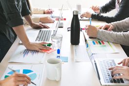 hands-on-desk-at-meeting